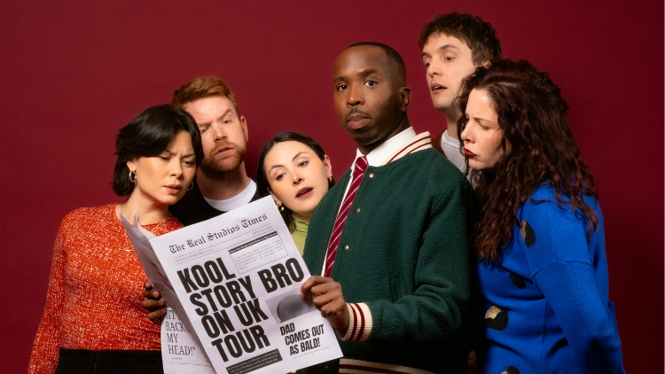 Griup of improv' comedians reading a broadsheet newspaper