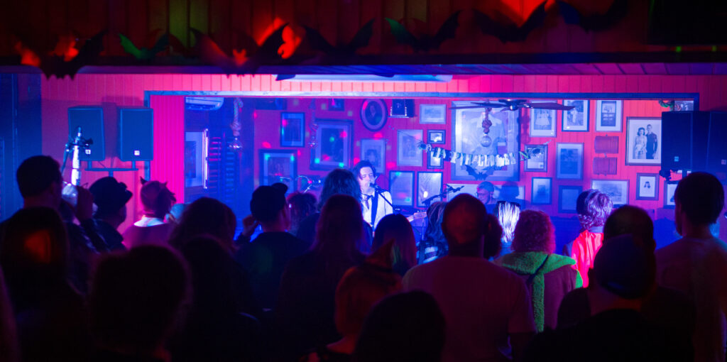 Scene of people enjoying a pop group on a stage. From last year's Penny Lane Weekender at the Tavern